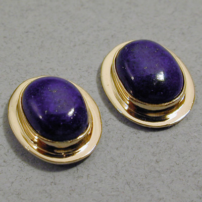 E-6: Lapis Lazuli cut en cabachon are the gemstones in this pair of 18 karat gold earrings. You can dress up with these earrings or look quite nice in your blue-jeans. For more information please call: (307) 382-3195