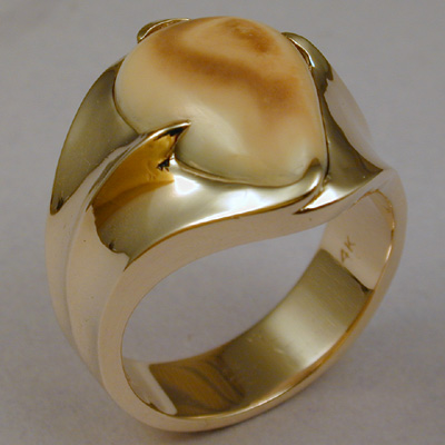 ER-1: A good choice if you like a bold, contemporary design that is very durable and comfortable to wear. This men's 18 karat gold ring and Rocky Mountain Elk Ivory will remind you of the Rocky Mountains for ever. ( $1,325.00 ) For more information please call: (307) 382-3195